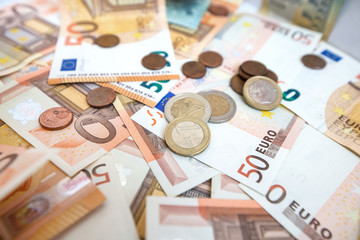 50 euro paper money and coins background. Hundreds of banknotes. Concept of cash flow, finances, rich people, business growth, success and development and millionaire
