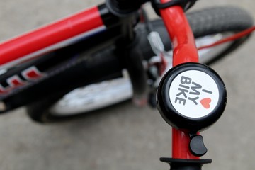 Bicycle steering wheel with bell and handles.
