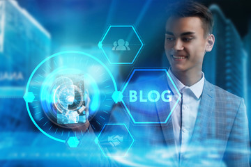 The concept of business, technology, the Internet and the network. A young entrepreneur working on a virtual screen of the future and sees the inscription: Blog