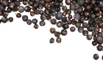Lot of whole dry juniper berry seed flatlay isolated on white background