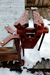 Working  table and from a tree with a vice of red color standing on the street.