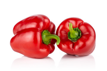 Group of two whole bulgarian red bell pepper isolated on white background