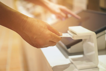 Obraz premium man person inserting card into scanner