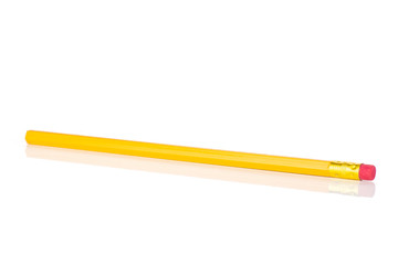 One whole unsharpened yellow pencil isolated on white background