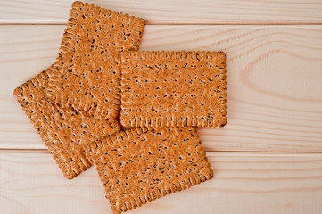 Dieting cookies with flax seeds and sunflower seeds and cracknels on the background