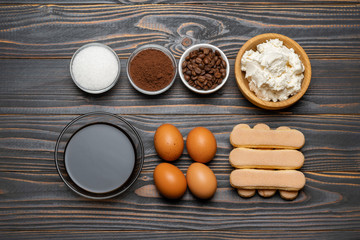 Ingredients for cooking tiramisu - Savoiardi biscuit cookies, mascarpone, cheese, sugar, cocoa, coffee and egg