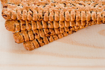 Dieting cookies with flax seeds and sunflower seeds and cracknels on the background