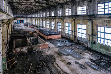 Old ruined abandoned concrete factory interior, aerial view