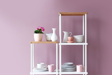 Rack with clean dishes in kitchen