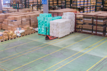 The Yellow Line breaks of empty space for keep material boxes or product boxes in warehouse area.(Blur picture)