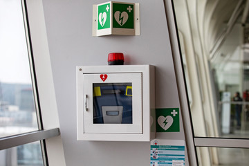 defibrillator attached to the wall at the airport