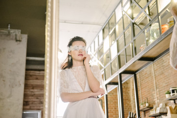 Girls in white wedding dresses are posing. Advertising of wedding dresses
