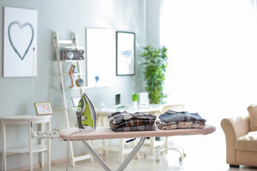 Modern iron and clothes on board
