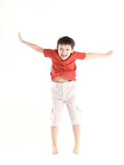 little boy performs a jumping exercise.isolated on white