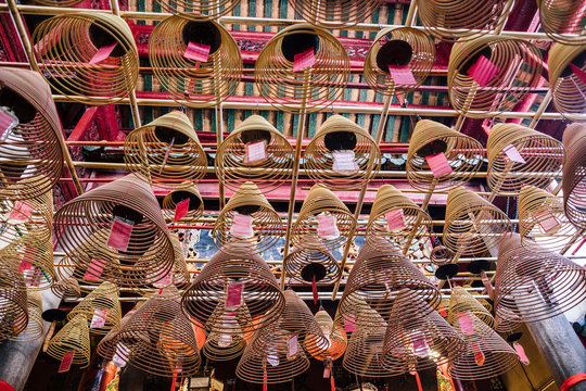 Hong Kong, Man Mo Tempel, incense spirals with prayers on papers
