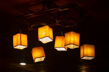 lantern light lamps hanging , interior decoration in room retro and vintage style .