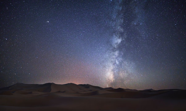 Morocco, Merzouga desert, Milky way over sand dunes