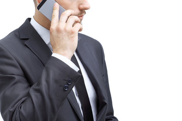 close up. businessman talking on a mobile phone.isolated on white