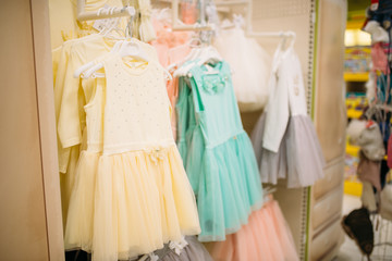 Store for newborns, showcase with dresses, nobody