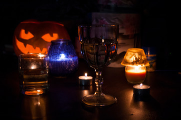 the pumpkin and the glass of wine