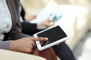 close up.business woman presses the digital tablet screen