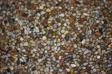 the structure of stones for the background. colorful stones in concrete, construction. for screen...