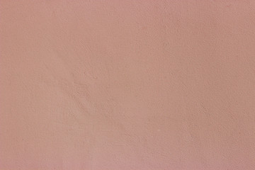 The wall of the building is a smooth peach color. Photo background.
