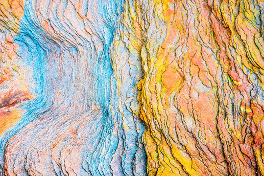 Colourful sedimentary rocks formed by the accumulation of sediments – natural rock layers backgrounds, patterns and textures - abstract graphic design – geology – nature formations