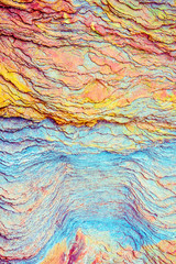 Colourful sedimentary rocks formed by the accumulation of sediments – natural rock layers backgrounds, patterns and textures - abstract graphic design – geology – nature formations - obrazy, fototapety, plakaty