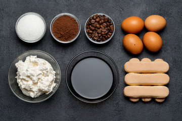 Ingredients for cooking tiramisu - Savoiardi biscuit cookies, mascarpone, cheese, sugar, cocoa, coffee and egg