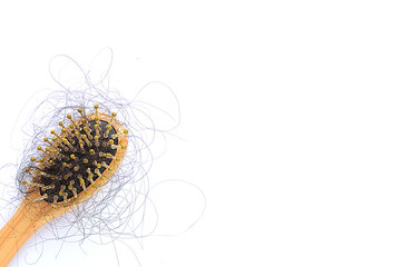 Hair loss, hair fall everyday serious problem, girl with a comb and problem hair.