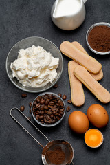 Ingredients for cooking tiramisu - Savoiardi biscuit cookies, mascarpone, cheese, sugar, cocoa, coffee and egg