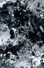 Artistic close up view of surreal winter river ice surface with a lot of detail.