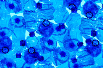 Used plastic bottles background. Recyclable waste.