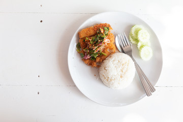 Fried fish spicy salad served with rice