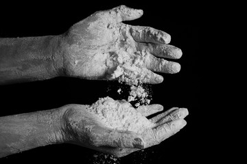 close up hands kneading dough. black and white