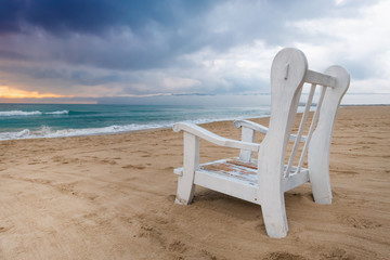 Armchair on the stormy sea shore