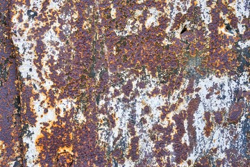 Abstract multicolored rusty metal background or corroded metal texture.