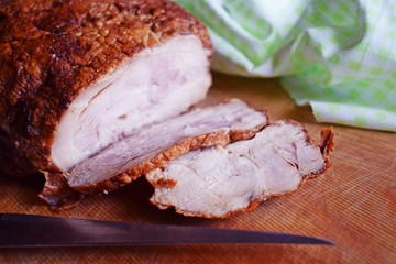 Delicious baked meat on a wooden Board.