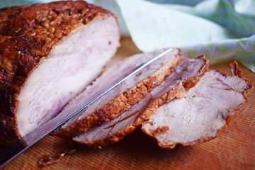 Delicious baked meat on a wooden Board.