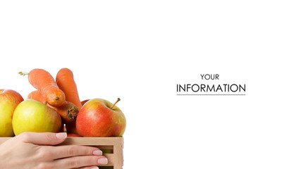 Wooden box of apples carrots in hand pattern on white background isolation