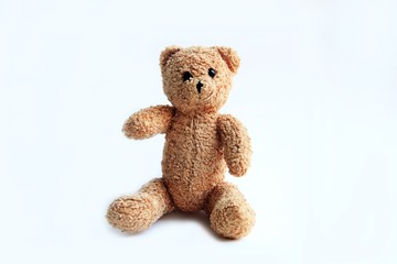 brown toy soft bear on white background childhood concept