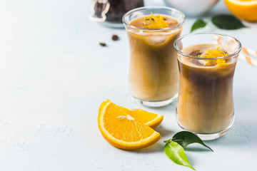 Creamy orange iced coffee . Selective focus, space for text.