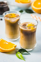 Creamy orange iced coffee . Selective focus, space for text.