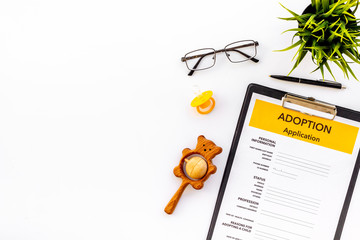 adoption application, glasses and dummy on white background top view copyspace