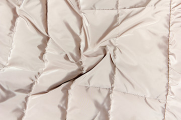 Obraz premium quilted beige raincoat fabric