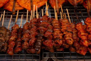 pork grilled , thai street food in market .