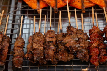 Pig liver grilled , thai street food in market .