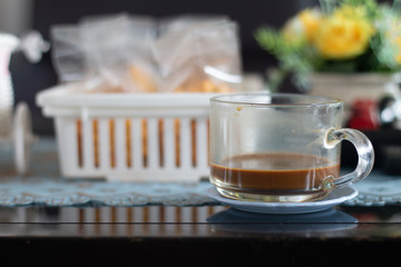 A coffee cup on wooden desk