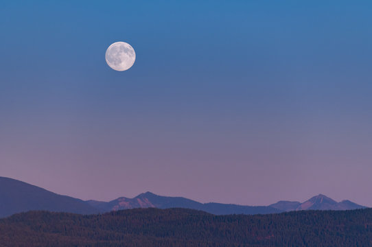 Scenic view of Swan Mountains at night